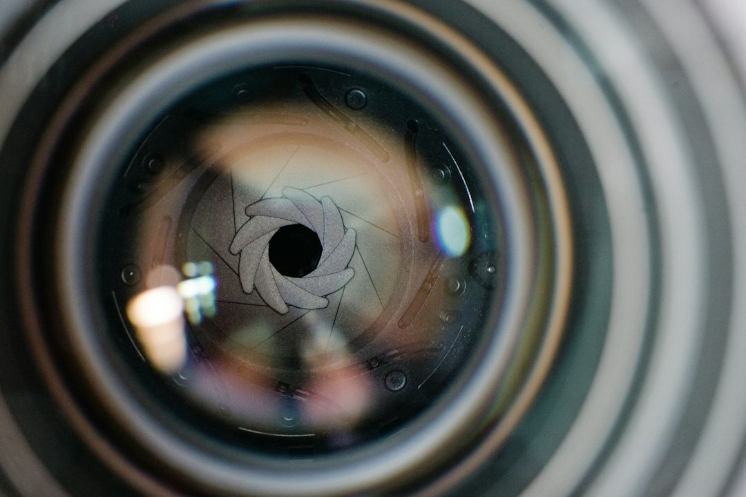 Close-up of a camera lens with reflected light
